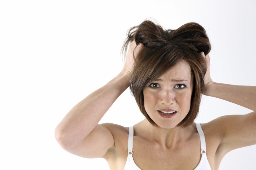 Confused and worried woman stressing over her website going down